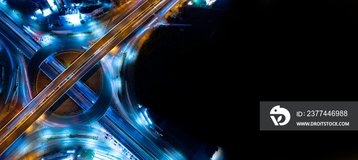 Aerial view of car traffic transportation above circle roundabout road of Drone aerial view fly , high angle. Public transport or commuter city life concept of economic and energy, infrastructure