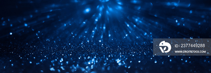 Abstract background of blue glitter lights. De-focused background.