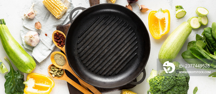 World vegan day concept. Empty grill pan with fresh vegetarian various ingredients for cooking vegan grilled food top view