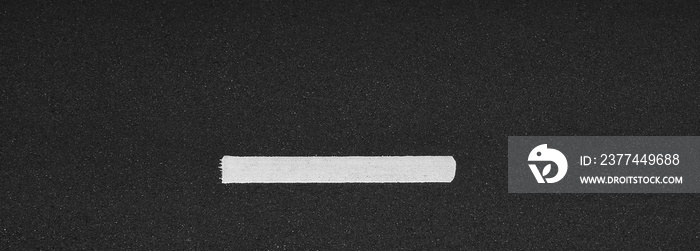 white line on black asphalt road texture