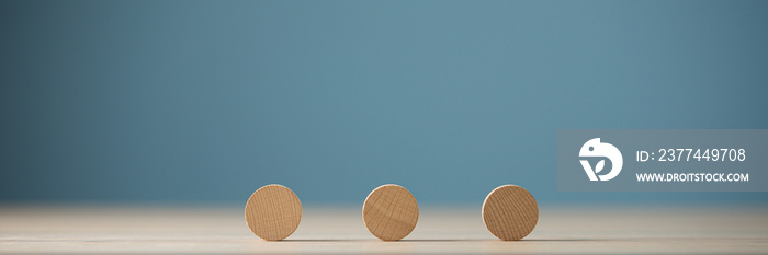 Three blank wooden cut circles placed in a row