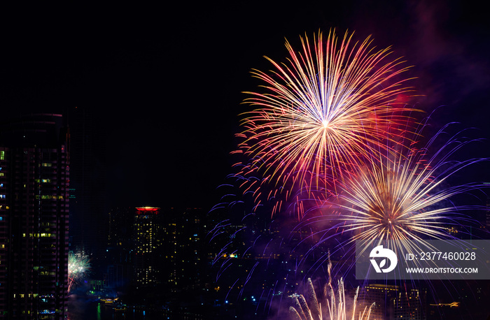 Celebration fireworks in the city at night time. landscape of Bangkok City. Thailand.