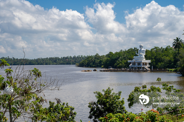 Bentota, Sri Lanka - The Benthara Buddha Statue, a large white religious figure, sits on the banks of the Bentota River