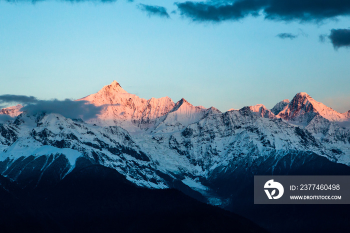 Sunrise at Snow Mountain Meili, a sacred mountain in Tibet, China.