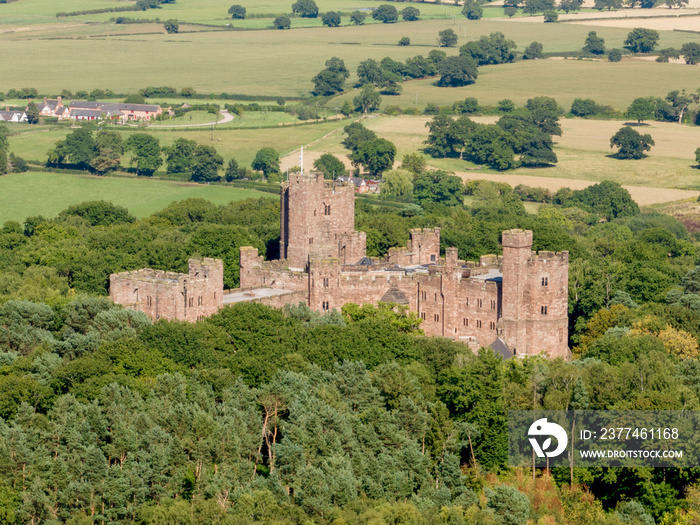 Peckforton Castle Cheshire, historic castle in rural Cheshire north west England, United Kingdom. Aerial view of the castle and wedding venue by drone