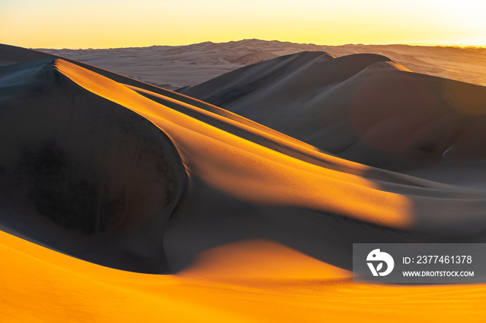 Sunset in the sand dunes and desert between Ica and Huacachina, Peru, South America.