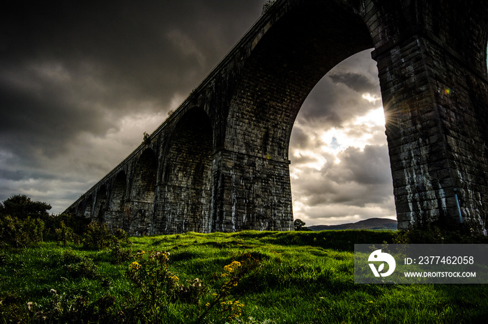 The Creeping Light: by a cloudy and rainy afternoon in a short instant the Sun succeeded to unfold its Light on the land under the Viaduct, Newry, County Down, Northern Ireland, United Kingdom