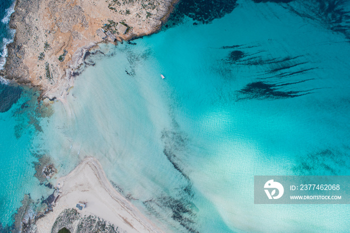 Best beach in Europe with turquoise waters with sand and rocks seen from the air with a drone.