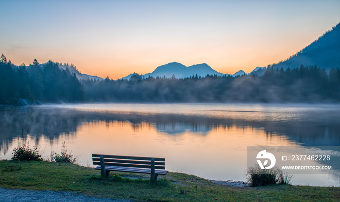 Relaxing place on the shore of Hintersee lake at sunrise