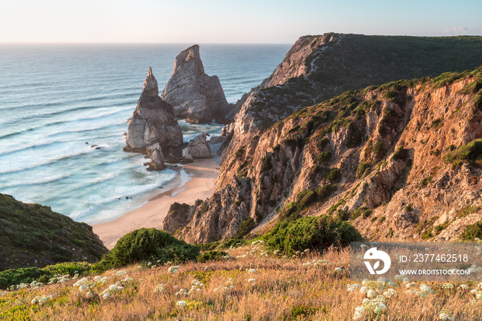 Beautiful Portuguese landscape. Blue Atlantic Ocean and amazing steep cliffs. Ursa Beach or Praia da Ursa next to Cabo da Roca, part of national park. Famous and popular tourist attraction in Portugal