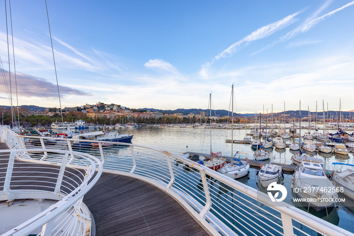 Pedestrian bridge in a touristic city, La Spezia, Italy. Sunset Sky.