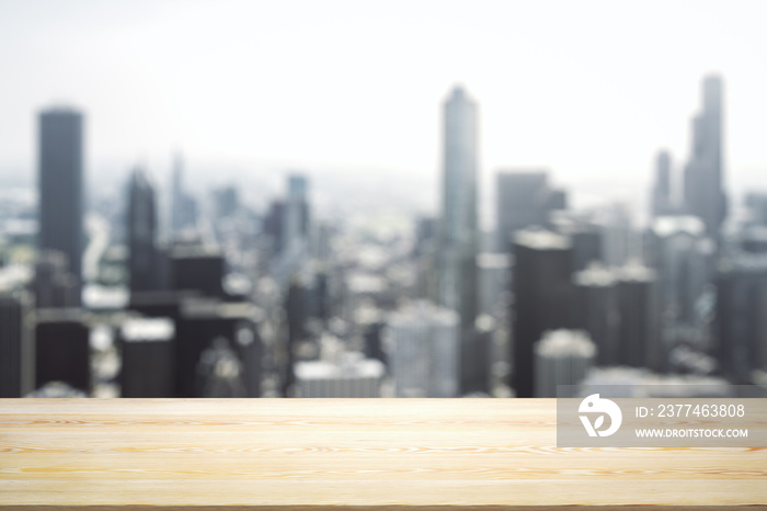 Blank tabletop made of wooden planks with beautiful blurry cityscape in the afternoon on background, mockup