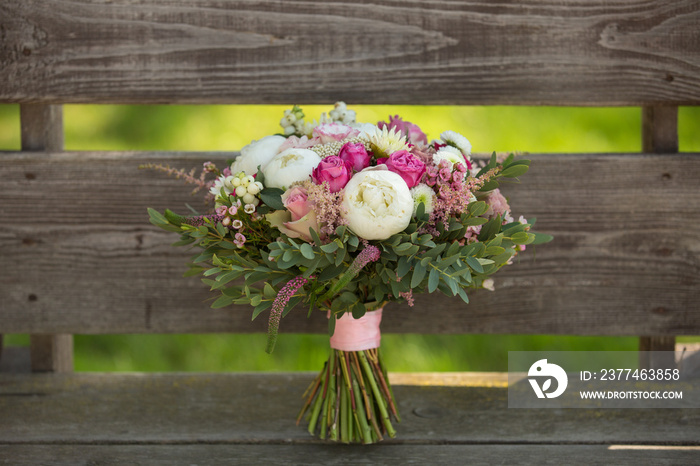 beautiful wedding bouquet of roses, peonies and other flowers