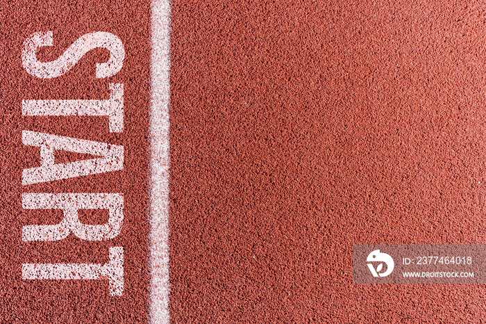 White painted line on tartan ground track in a athleticism and sports field.