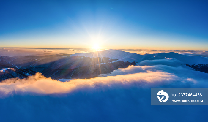 Flight through evening sky with clouds over mountain