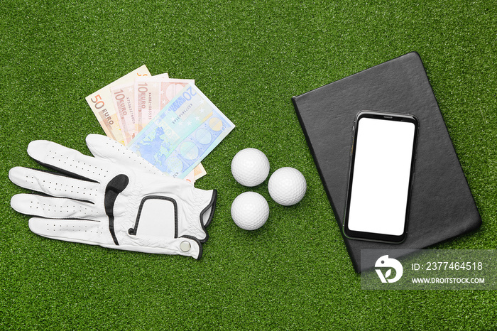 Money, mobile phone and golf glove on color background. Concept of sports bet