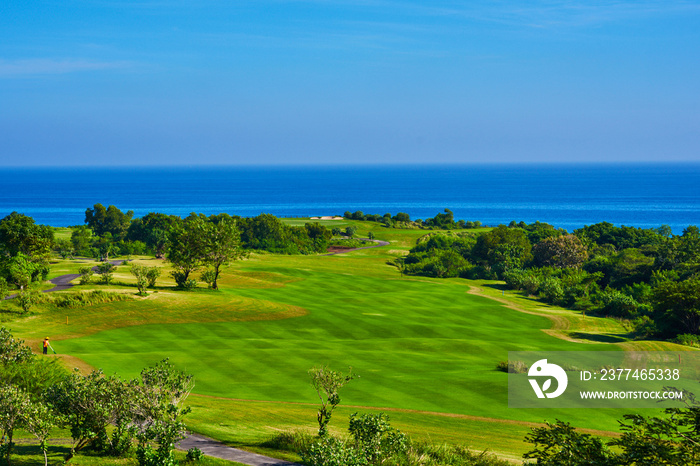 View of golf course with green grass. Golf course with a rich green turf beautiful scenery. Stunning view of a coastal golf course. Golf place with wonderful green.