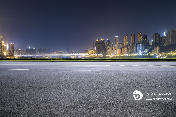 Panoramic skyline and buildings with empty road，chongqing city at night