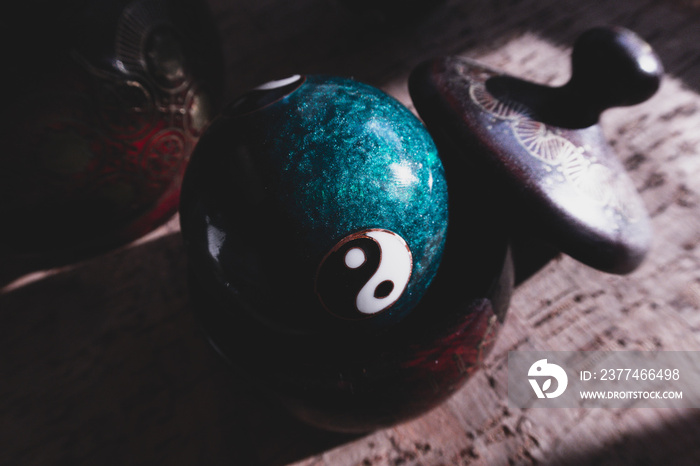 Close-up of a Chinese yin yang balls,  harmony of the world and the universe, Qigong balls with yin yang symbol