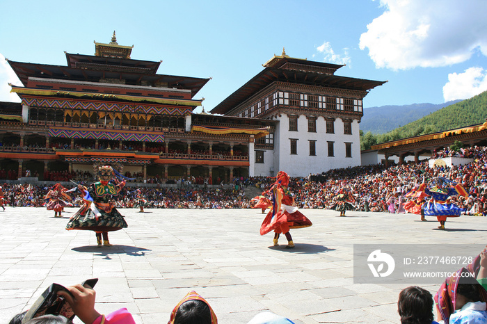 Traditional dances during a religious festival (tsechu) in a dzong in Thimphu (Bhutan)