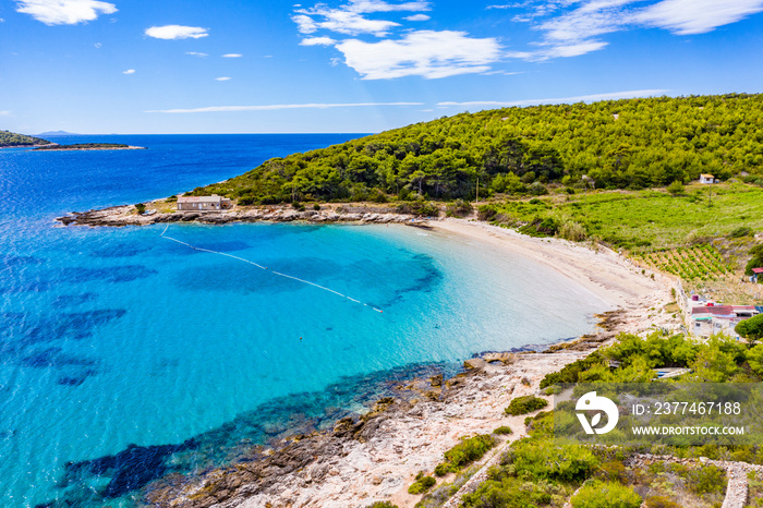 View of beautiful bay with blue turqoiuse sea on Mediterranean coast. Sailing destination. Summer vacation nackground with copy space. Vis island, Milna bay, Zaglav sandy beach. Seascape, cloudy sky