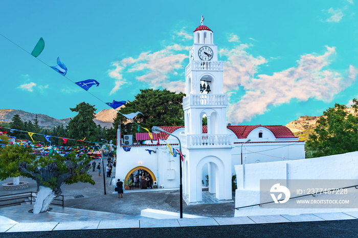 Tsambika monastery with bell tower during feast (Rhodes, Greece)