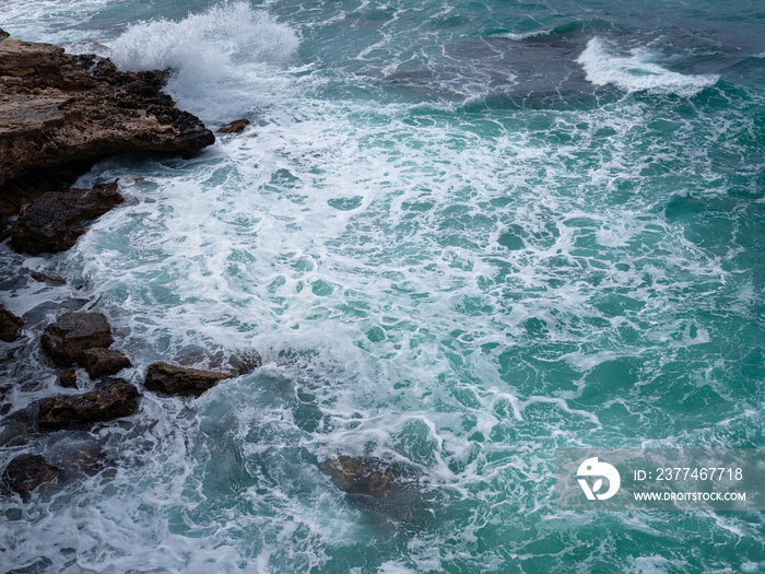 Beautiful view of ocean waves and a fantastic rocky shore, Sea patterns, background wallpaper.