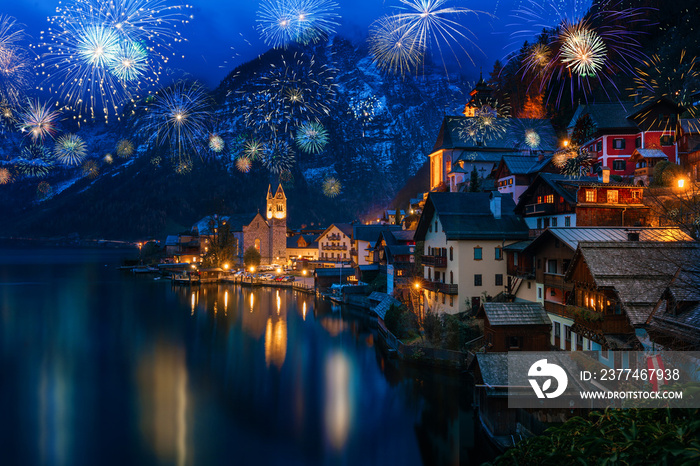 Hallstatt in Austria celebrating New Years Eve with flashing colorful fireworks