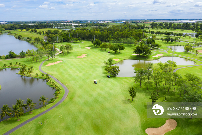 Aerial view of pound on golf course with player, footpath on golf course, playr enjoying the game under sun, golf field..