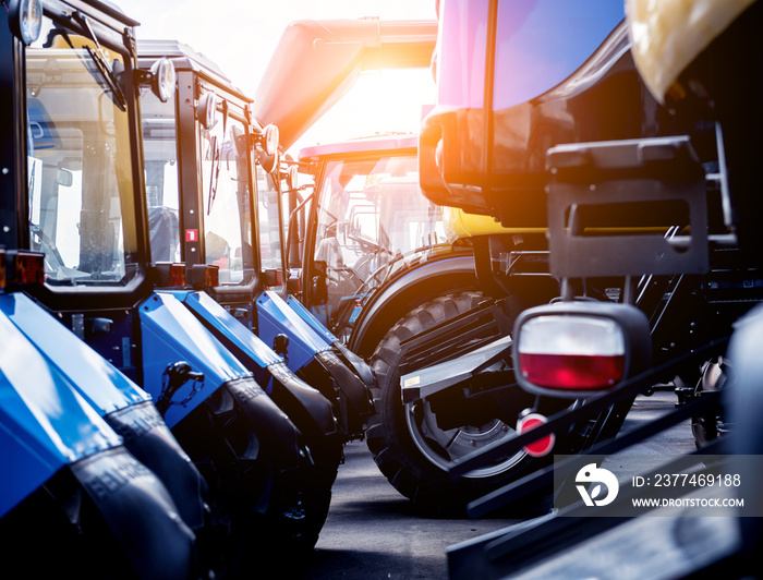 Rows of modern tractors. Industrial details. Agricultural