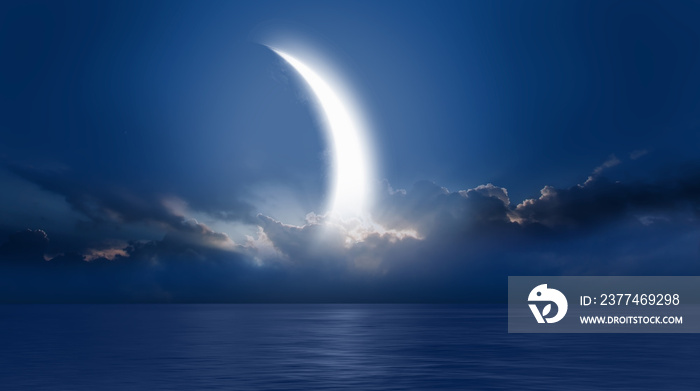 Night sky with crescent moon in the clouds  Elements of this image furnished by NASA