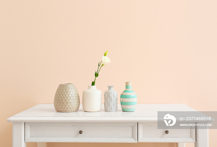 Beautiful vases with flower on light table