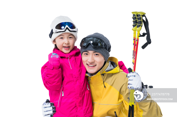 年轻爸爸和女儿滑雪
