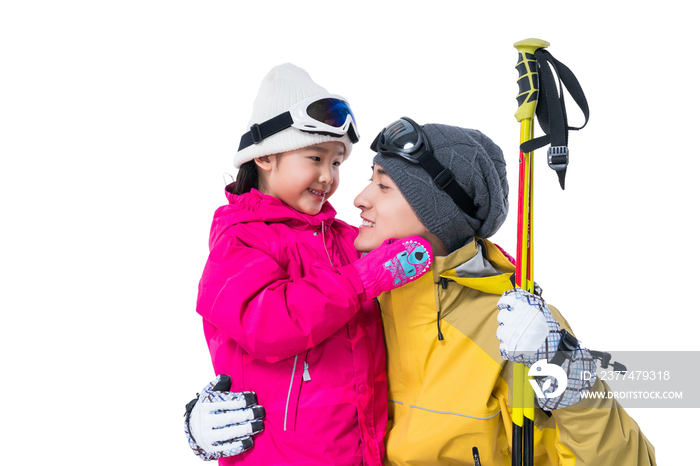 年轻爸爸和女儿滑雪