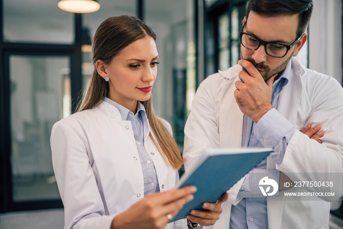 Two doctors discussing a medical case, close-up, portrait.