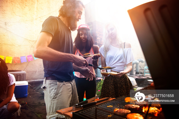 Friends having grill in city