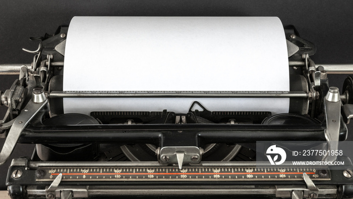 Vintage typewriter with blank sheet of paper retro technology