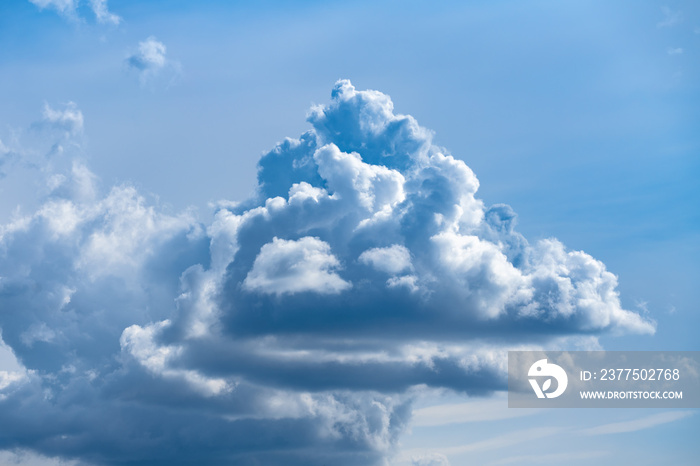 Beautiful cloud formation floating in a bright blue summer sky