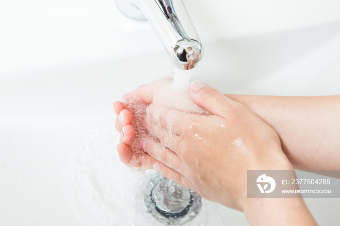 Washing hands with soap under running water. Concept healtcare and medical