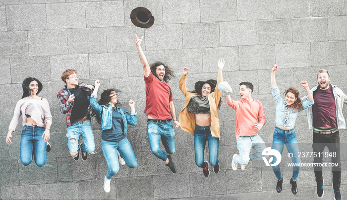 Happy millennials friends jumping outdoor for celebrating