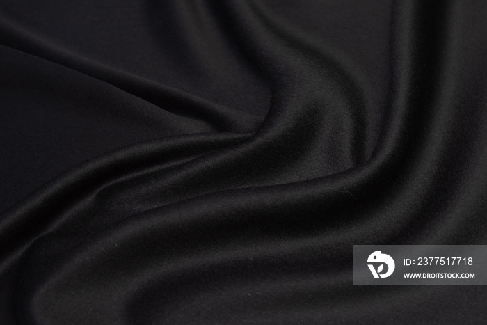 Black wool fabric texture with vignette