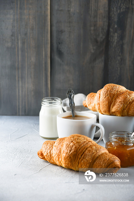 coffee with milk and croissants, jam