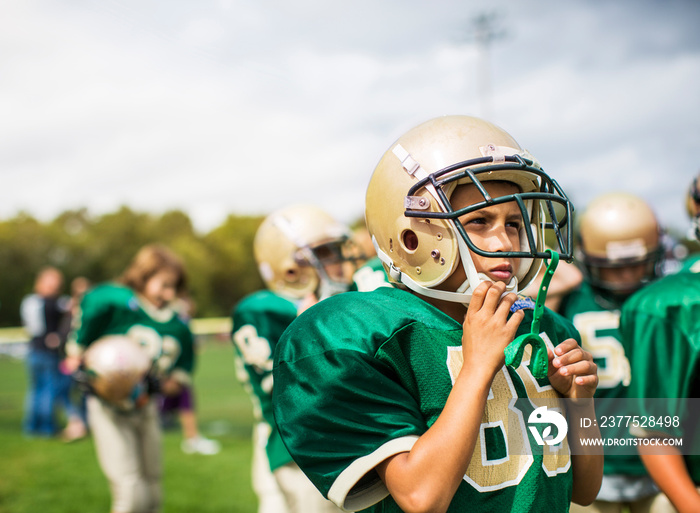 American football team walking in field