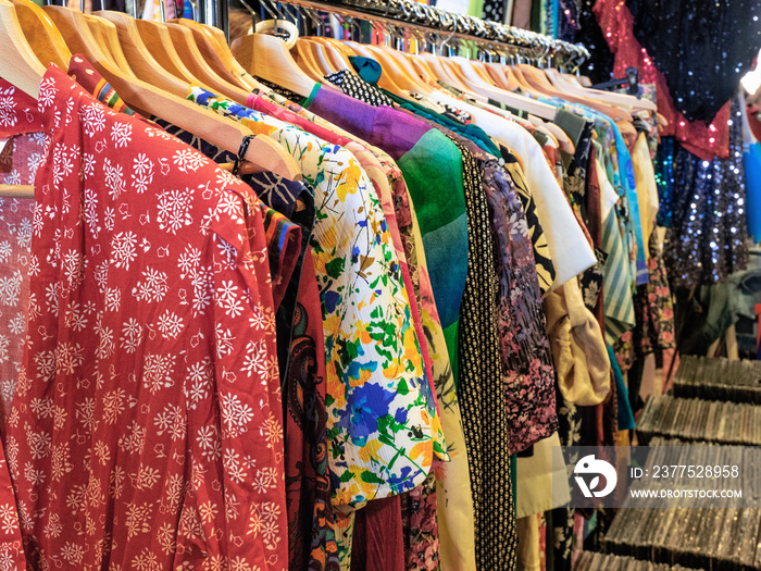 Milan - Italy. Display of brightly colored womens clothes at the flea market