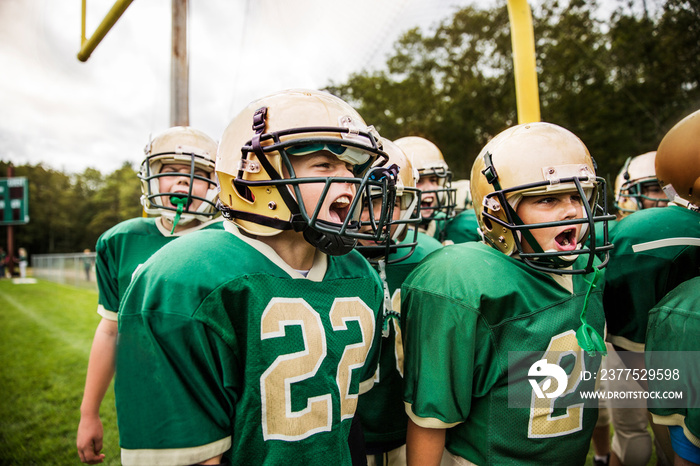 American football players shouting in field