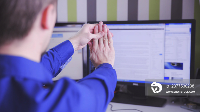 Wrist stretching of person in the office