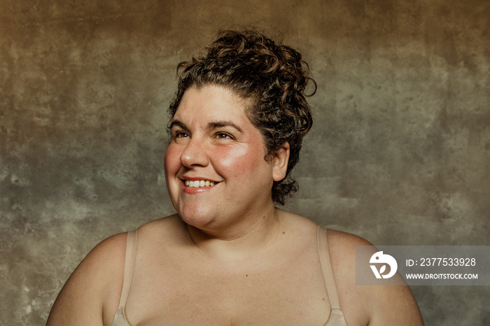 close up portrait of a plus size womans face looking up