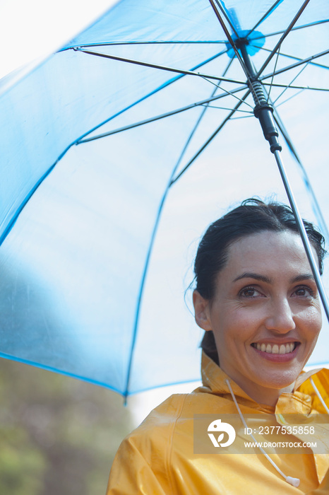 Portrait smiling woman with umbrella