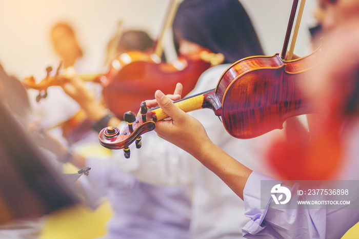 Musician is practicing violin in a music practice classroom prepare for performing violin stage. Con