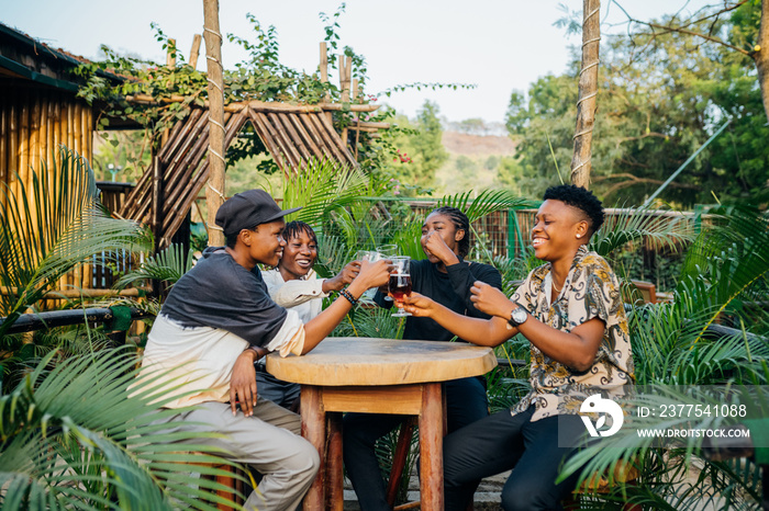 Queer masculine women having a beer in a garden